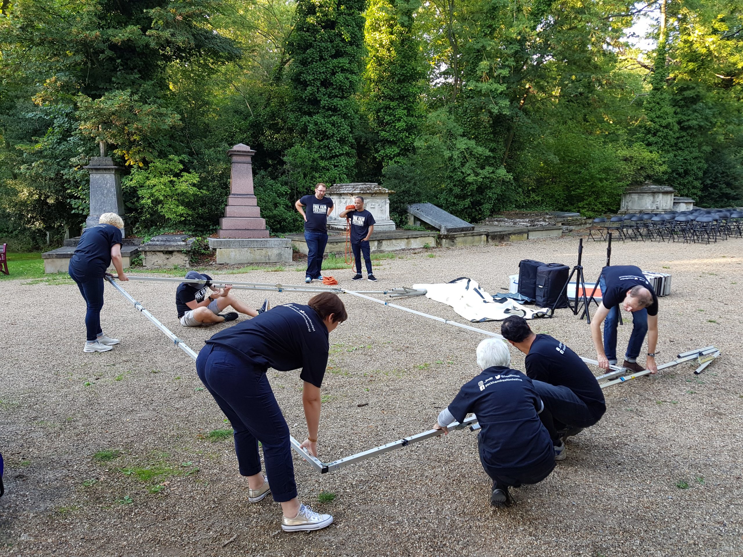 Volunteers putting up screen